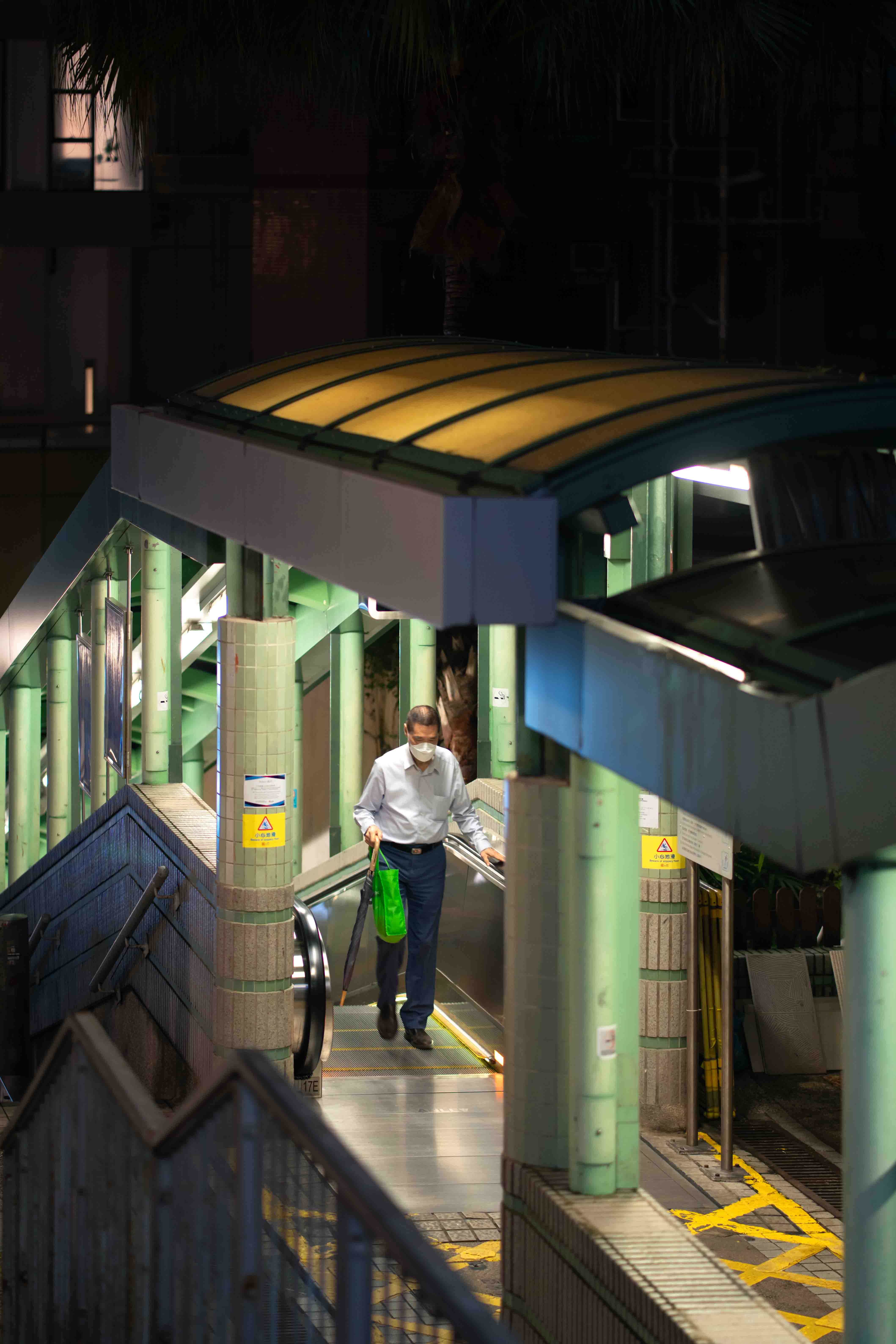 Uncle taking the Mid-Levels escalator back home