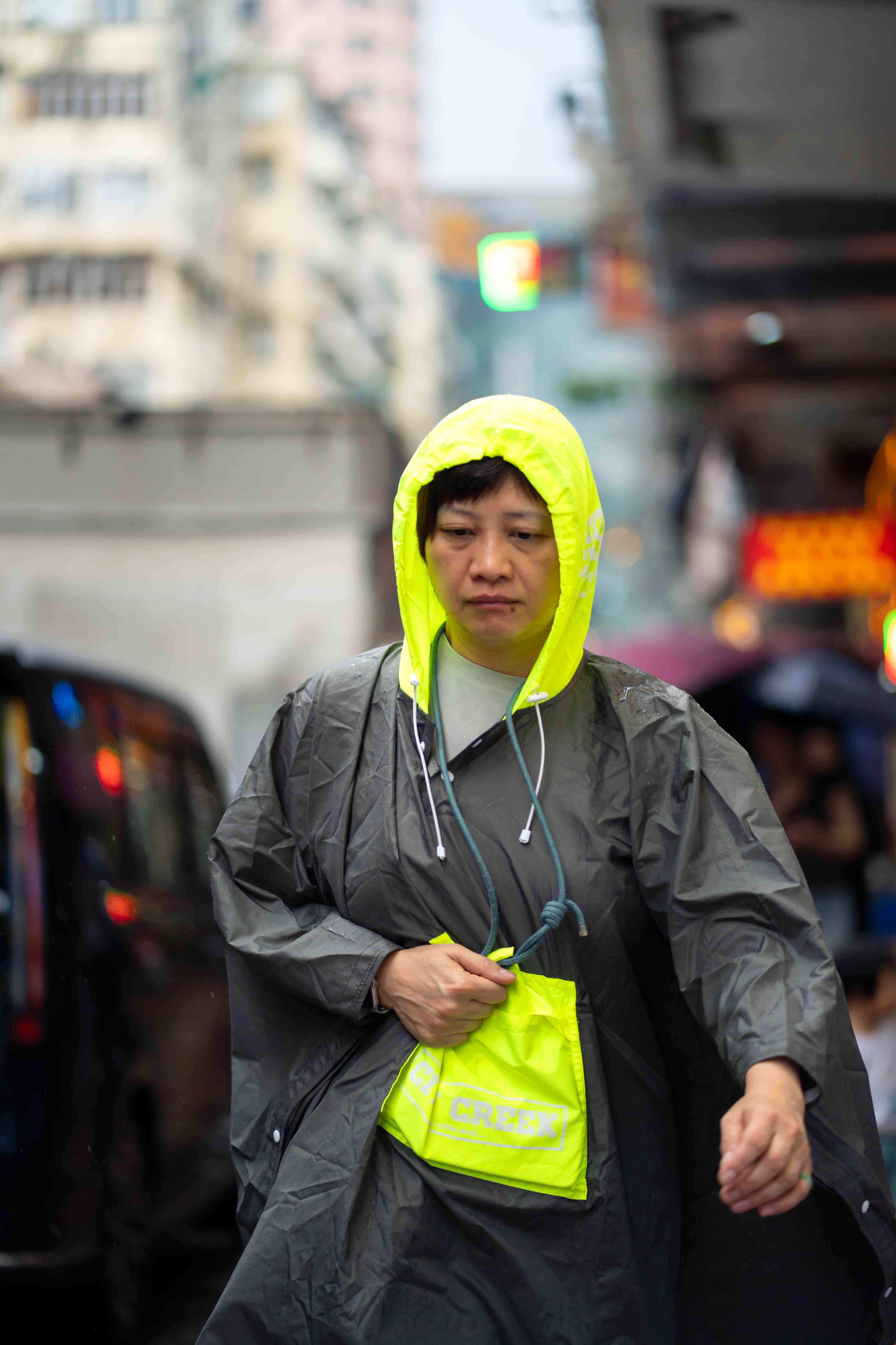 Auntie in a bright luminous raincoat