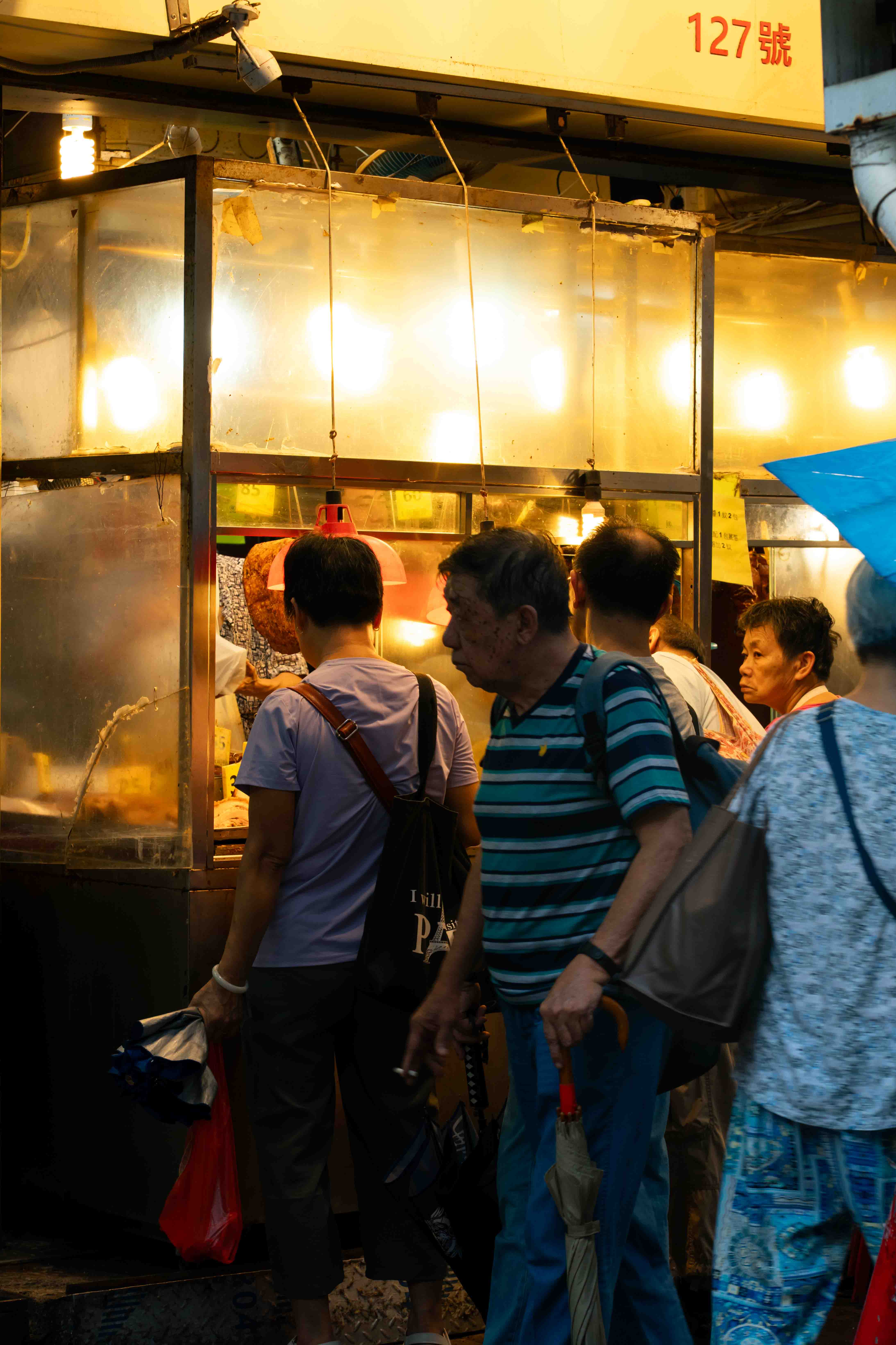 Crowd around a roast meat stall